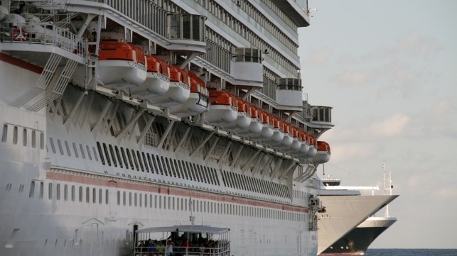 lifeboats ported on the side of a cruise ship