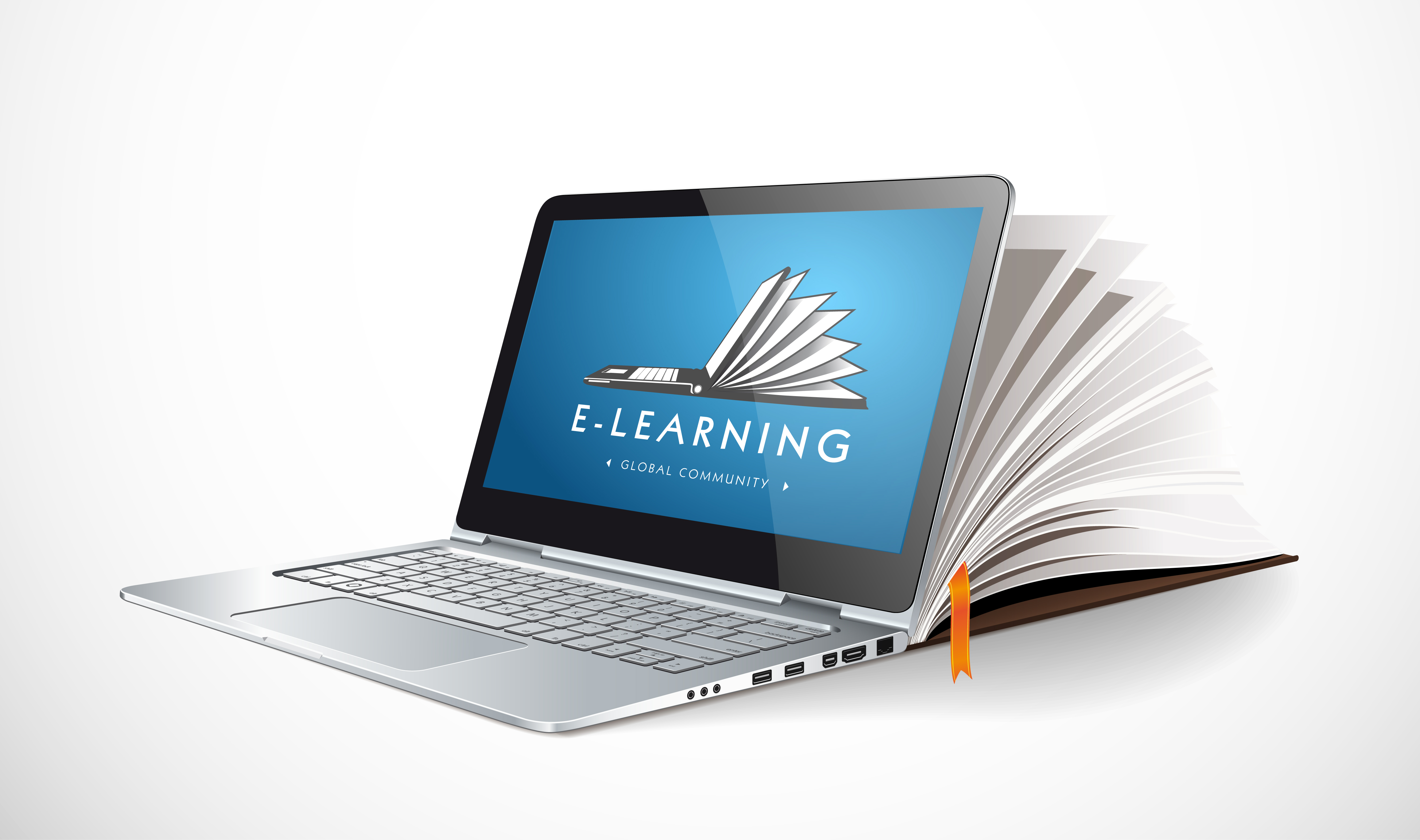 laptop and book set up for online learning